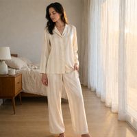 The Champagne Stripe — Champagne ivory pajama set, lifestyle pose
